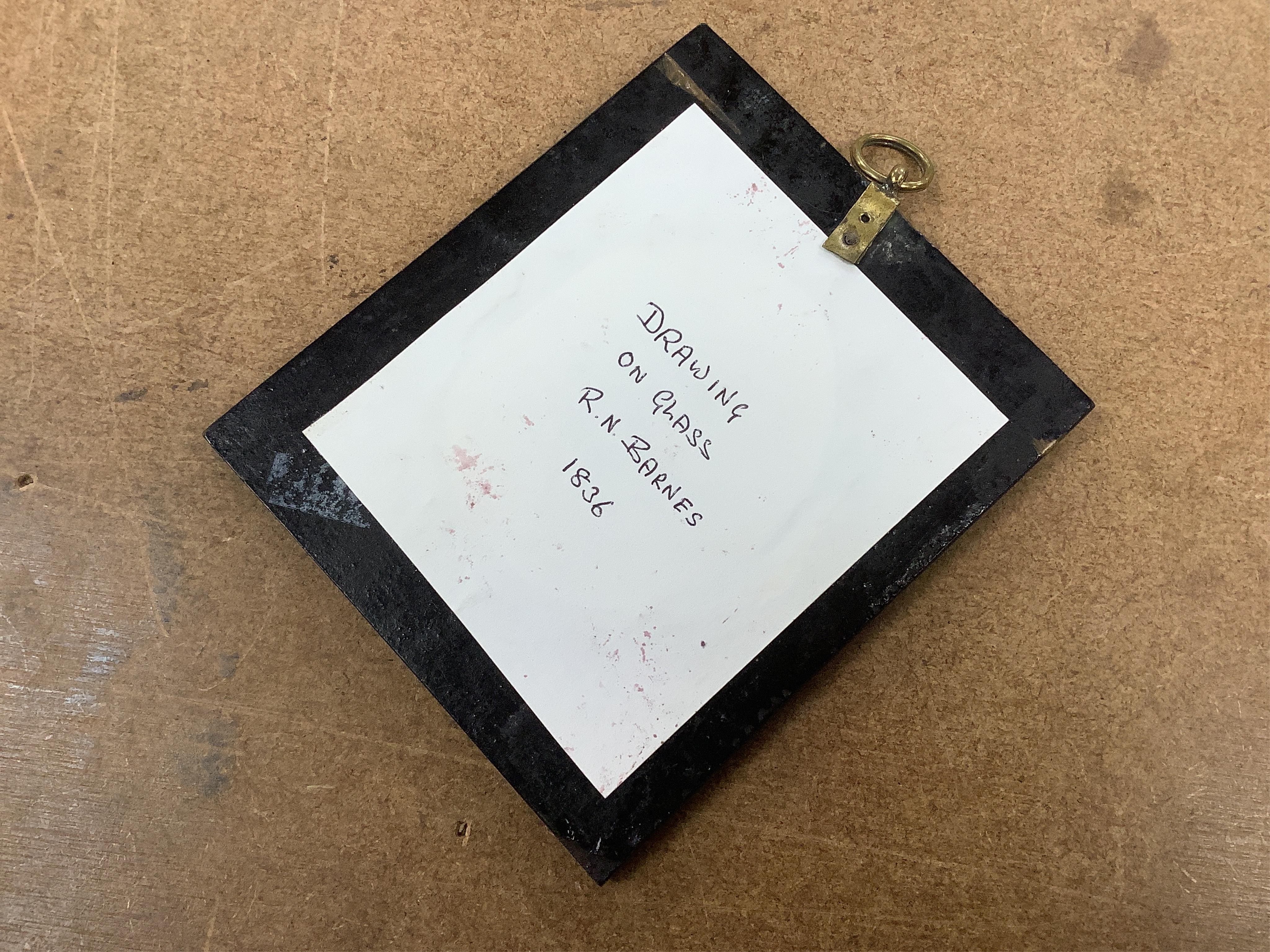 Two 19th century silhouette portraits to include one painted on glass by R. N. Barnes 1836 together with a portrait miniature of a Regency lady and an enamel example, largest 8 x 6.5cm (4)